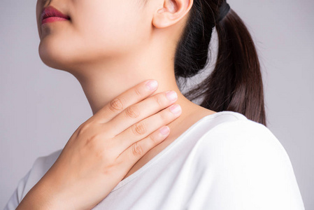 Sore Throat. Closeup Of Beautiful Young Woman Hand Touching Her 