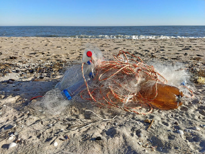 Empty used dirty plastic bottles, bags, fishing net,garbage dump