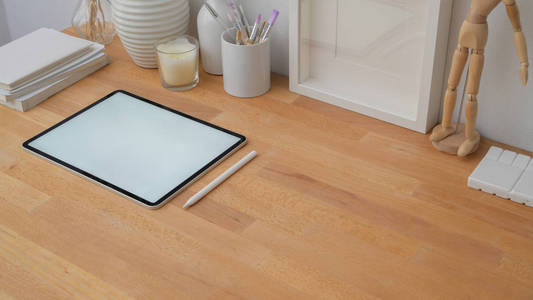 Cropped shot of modern workspace with blank screen tablet, stylu