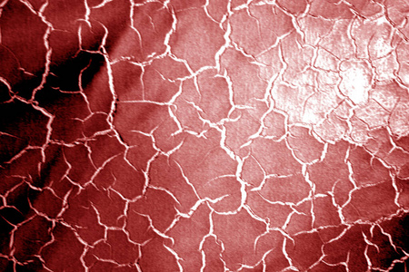 Grungy leather surface with blur effect in red tone. 