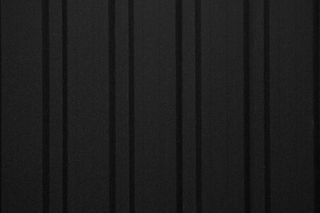 黑色波纹金属板纹理墙面。镀锌钢背景。