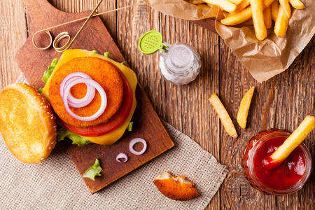 Delicious fish burgerserved with fresh french fries. 