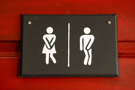 有趣的厕所带有有趣图标图形的厕所标志照片