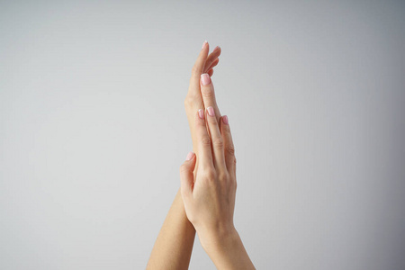 Spa and Manicure concept. Beautiful hands of a young girl with b