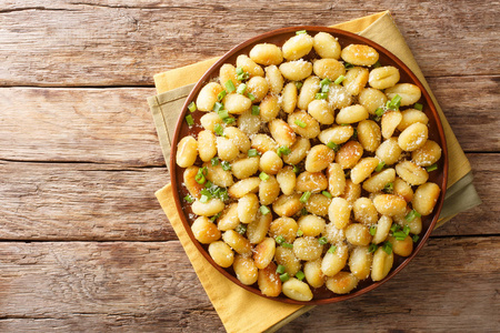 Gnocchi crisped in garlic and green onion infused butter with a 