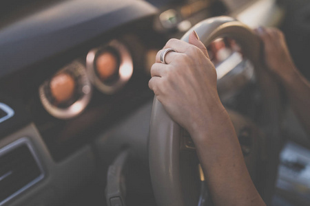 Pretty, young woman  driving a car 