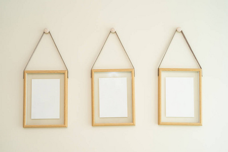 Empty photo frame on wall decoration interior