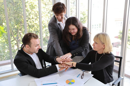 medium shot multiethnic business people sitting in  meetin