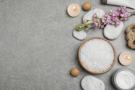 Flat lay composition with cosmetics on grey marble table, space 