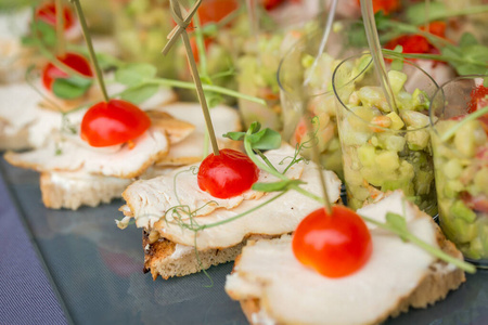  buffet tables with various canapes appetizers buffet sandwiches