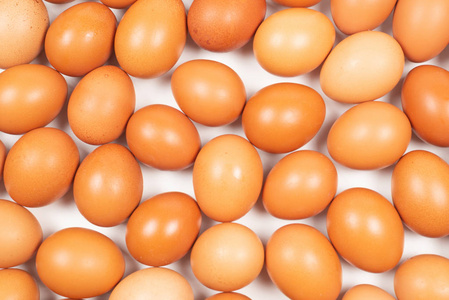 Group of raw brown eggs. 