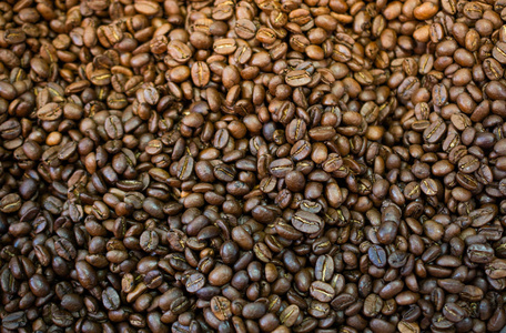 Coffee beans ready for the grinder background 