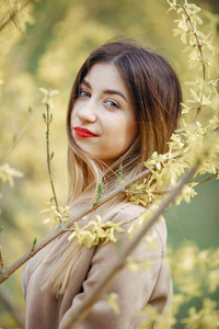 Elegant little girl in a spring park