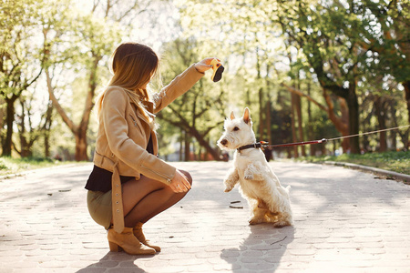 Elegant little girl in a spring park