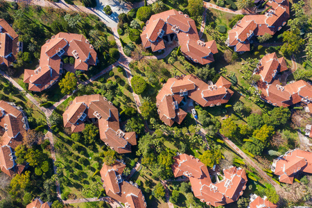 Aerial view of suburban neighborhood with big villas next to eac