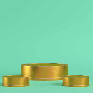 Golden cylindrical display stands on bright green background in 