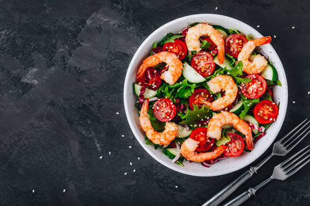 Shrimp salad with fresh green lettuce and radicchio leaves, cucu