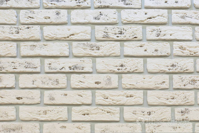 白砖墙用纹理粗糙的多孔石砌成装饰性墙面装饰背景纹理白色石灰石砖墙