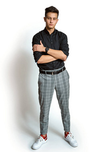 Fashion portrait of young man in shirt on white background 