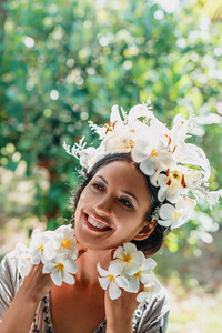 close up of beautiful young woman wearing wreath 