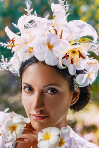 close up of beautiful young woman wearing wreath 