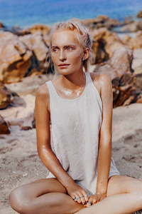 beautiful young fashion model on the beach. Close up portrait 