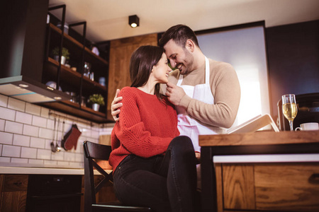 Beautiful couple are hugging and smiling while spending time in 