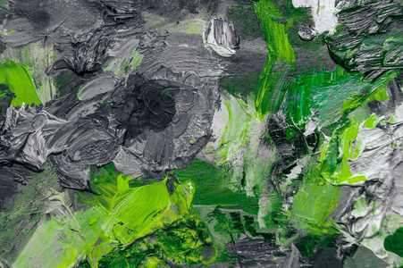 黑色和白色与绿色的油画颜料背景。