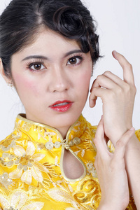 Young beautiful woman in Chinese Cheongsam modern makeup 