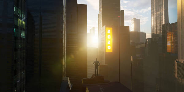 Young businessman standing on rooftop of a skyscraper 