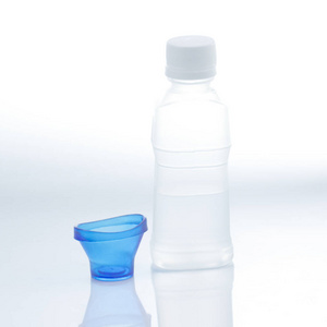 Bottle of eye solution with cup 