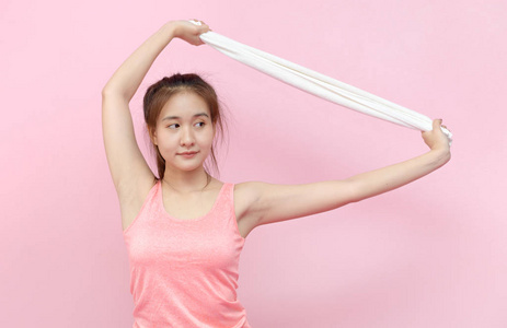 portrait of asian sporty young woman with towel 