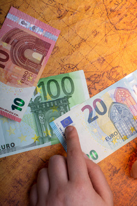 Hands holding cash euro banknotes currencies. 