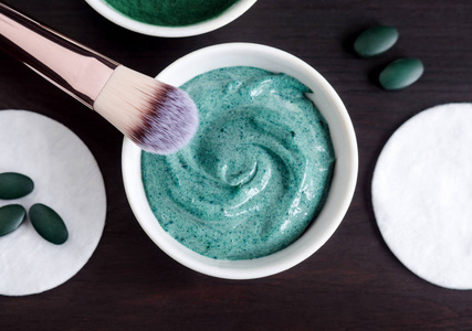 Spirulina and yogurt facial mask in the small white bowl. Natura