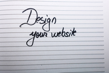 Design your website, handwriting text on page of  agenda. 
