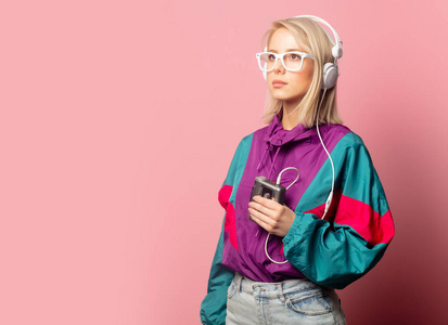 woman in 90s clothes with headphones 
