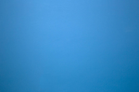 纯色石墙上的蓝色作为背景纹理.美丽的现代复古色彩照片