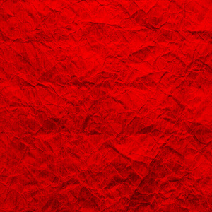红色牛皮红纸.皱巴巴的牛皮纸的纹理是红色的.再生纸背景.