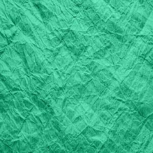 Mint color of old wrapping paper. The texture of crumpled kraft 