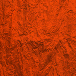 Orange worn paper. Texture rumpled craft paper Lush Lava color. 