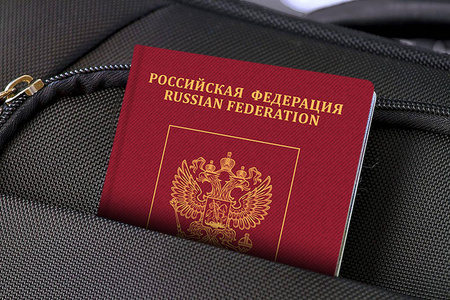 Close up of Russia Passport in Black Suitcase Pocket 