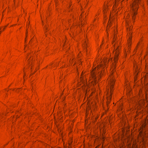 Crumpled orange paper. Texture kraft paper Lush Lava color. Recy