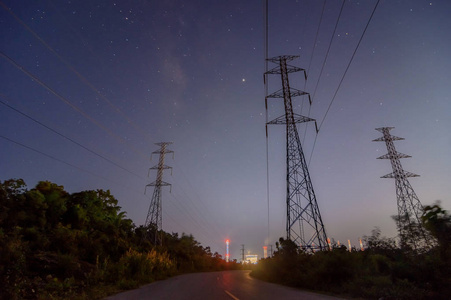  High voltage electricity pylon at night.