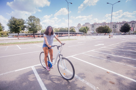 Pretty Woman Having Fun Riding Bicycle 