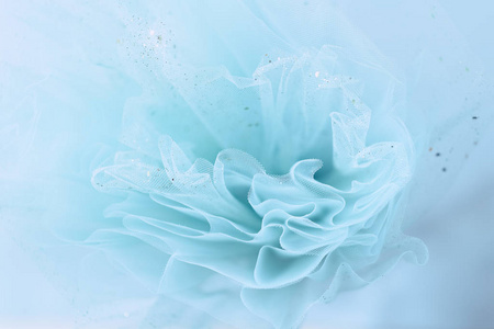 柔美的绿松石面料背景,金色闪光照片