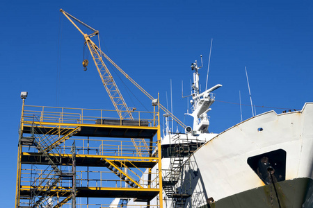 Ship in the shipyard for maintenance and repairs with scaffolds 