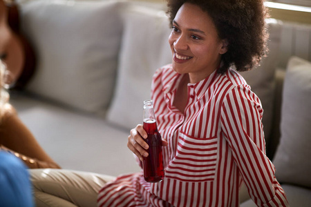 Female person with bottle of drink 