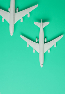 Two  jet airplane on pastel color background. Travel around the 