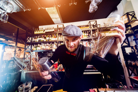 Bartender is making cocktail at bar counter. Fresh cocktails. Ba