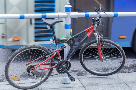 Bicycle parked at the edge of the road 